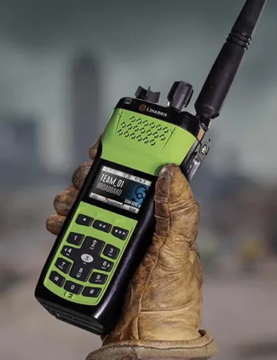 First responder and teacher using P25 two-way radios for public safety and school communication