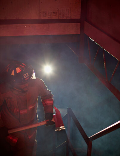 firefighter climbing staircase